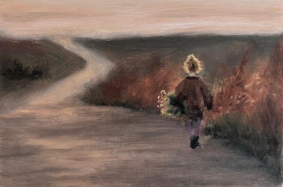 A small child with a blonde ponytail walks away down a dusty road at dusk, carrying an armful of wildflowers past tall reddish grasses, under a pale pink sky.